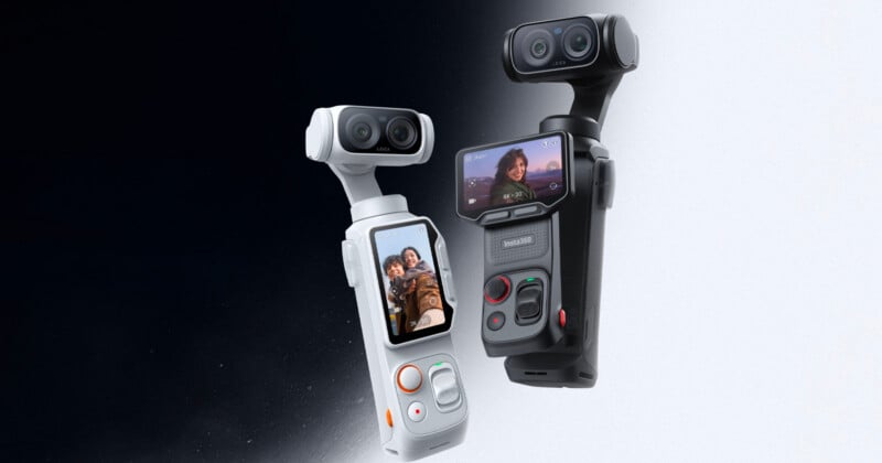 Two handheld 3D cameras, one white and one black, each with a touchscreen displaying selfies, stand side by side against a gradient black-to-white background. Both have dual lenses and control buttons.
