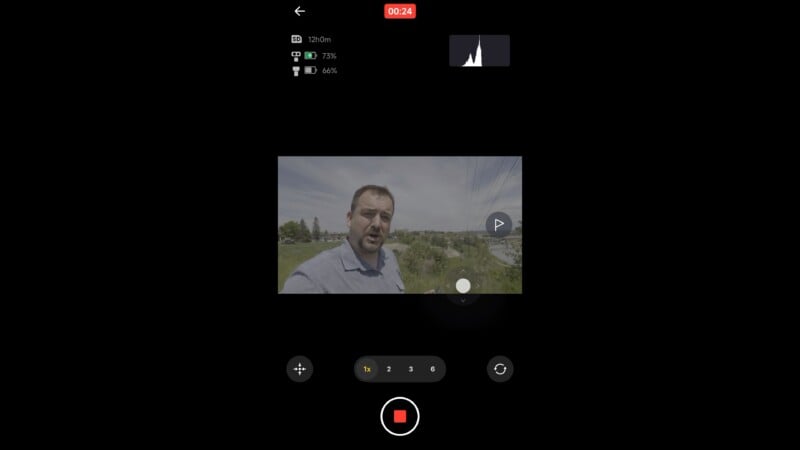 Screenshot of a camera recording interface showing a man outdoors in front of greenery and buildings. The recording timer reads 24 seconds, with various camera settings and a red stop button visible on the screen.