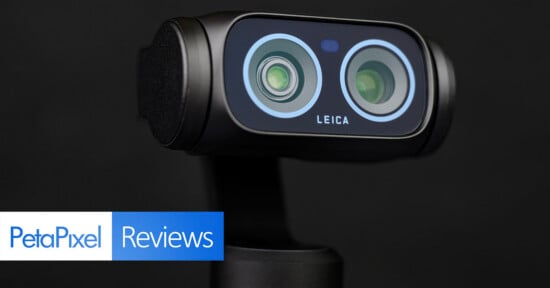 Close-up of a Leica camera with dual lenses against a black background, with "PetaPixel Reviews" text in blue and white at the bottom left corner.