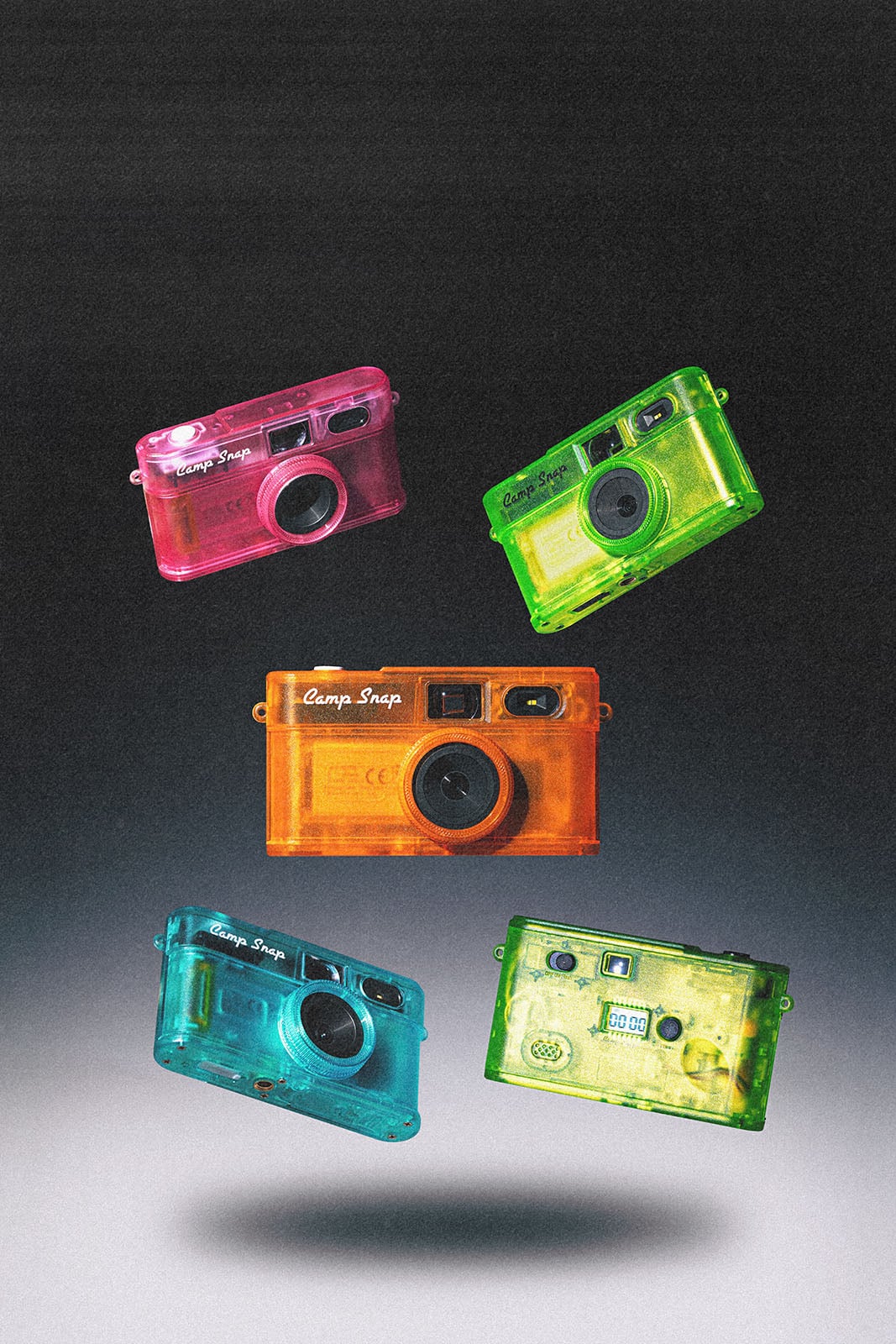 Five colorful, transparent plastic cameras—pink, green, orange, blue, and teal—float against a gradient black background, arranged in a loose circle with varied orientations.