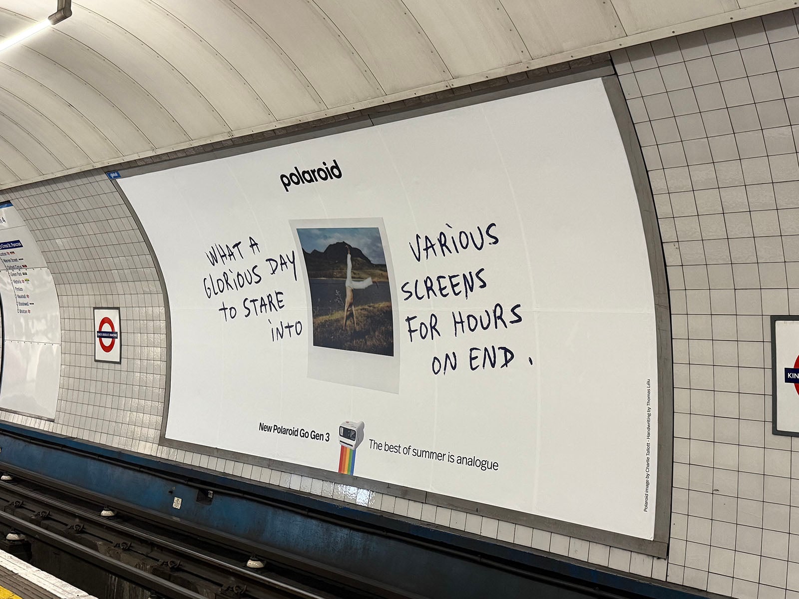  “What a glorious day to stare into various screens for hours on end.” London Underground signs are visible on the tiled wall.