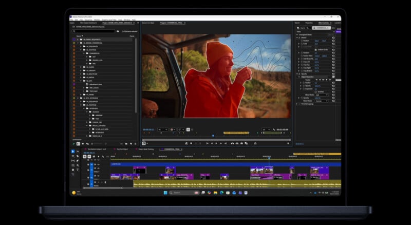 A laptop screen displays video editing software with a video clip of a person in an orange hat and jacket, highlighted by a red mask. Timeline, editing tools, and adjustment panels surround the preview window.