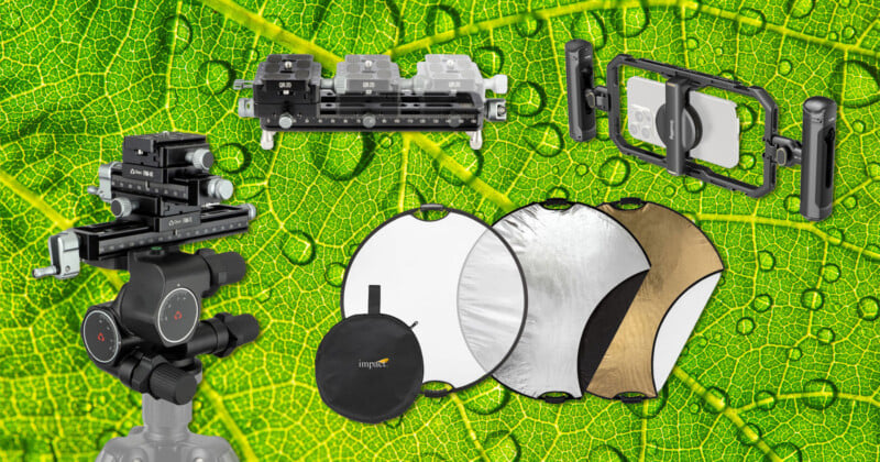 A close-up leaf background with water droplets, featuring photography accessories: a geared tripod head, macro focusing rail, phone mount with lenses, and three round reflectors (white, silver, and gold) with their carrying case.