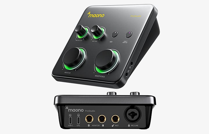 A black Maono ProStudio audio interface with two large knobs, two smaller knobs, glowing green accents, and multiple input/output ports shown from a top angle and a front view.