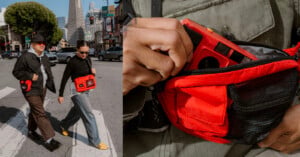 Two people wearing sunglasses walk across a city street, each carrying bright red crossbody bags. A close-up shows a hand placing a red camera into the bag's zippered pocket. Tall buildings and trees are visible in the background.