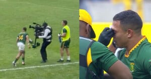 A rugby player in a green uniform collides with a cameraman on the field; in the next image, he is receiving medical attention for his eye from a team staff member.
