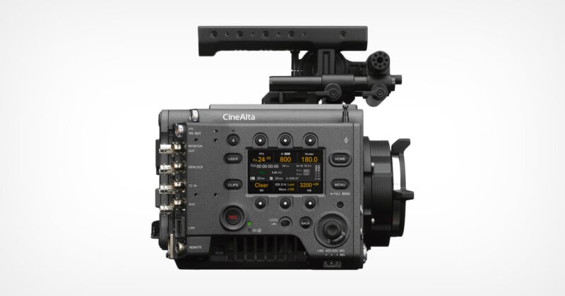 A professional Sony CineAlta digital cinema camera, shown from the side with various buttons, dials, ports, a display screen, and a top handle attachment on a plain white background.