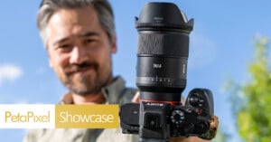 A man holds a Sony camera with a large 24mm lens towards the viewer, smiling outdoors against a blue sky. The Petapixel Showcase logo appears in the bottom left corner.