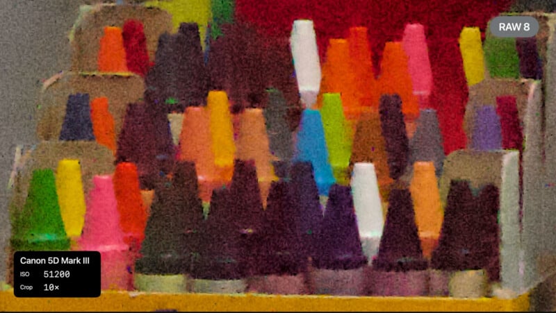 A noisy, grainy photo of colorful thread spools arranged in rows, showing heavy image noise. Overlay text reads “Canon 5D Mark III, ISO 51200, Crop 10x” and a label “RAW 8” is in the top right corner.