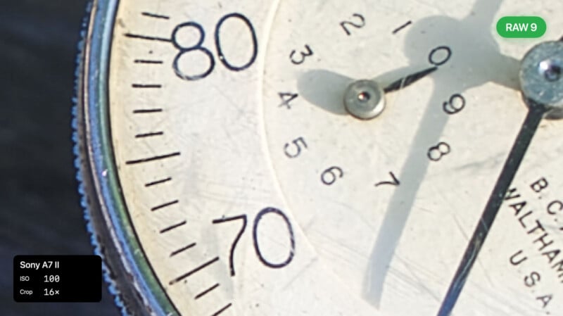Close-up of a vintage analog gauge or meter with numbers 70 and 80 visible, needle pointing near 77. Labels for "Sony A7 II," camera settings, and "RAW 9" are also shown on the image.