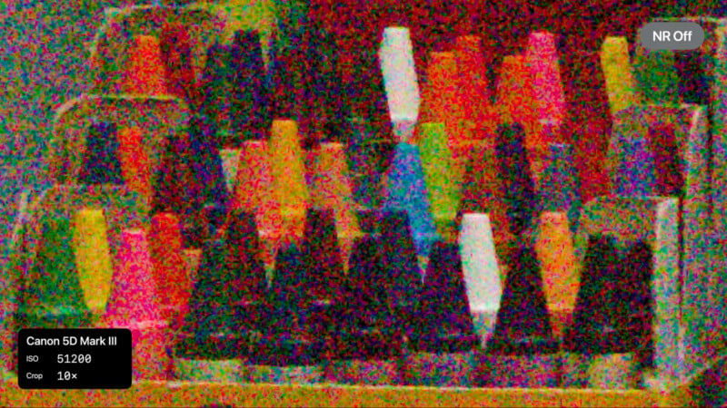 A highly grainy, noisy photo showing rows of colorful cones of thread. A label in the lower left corner reads "Canon 5D Mark III, ISO 51200, Crop 10x". The noise reduction is turned off.