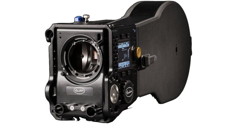 A professional-grade black Arri Alexa film camera with a digital display screen, various buttons, and dials, viewed from a front side angle, without a lens attached.