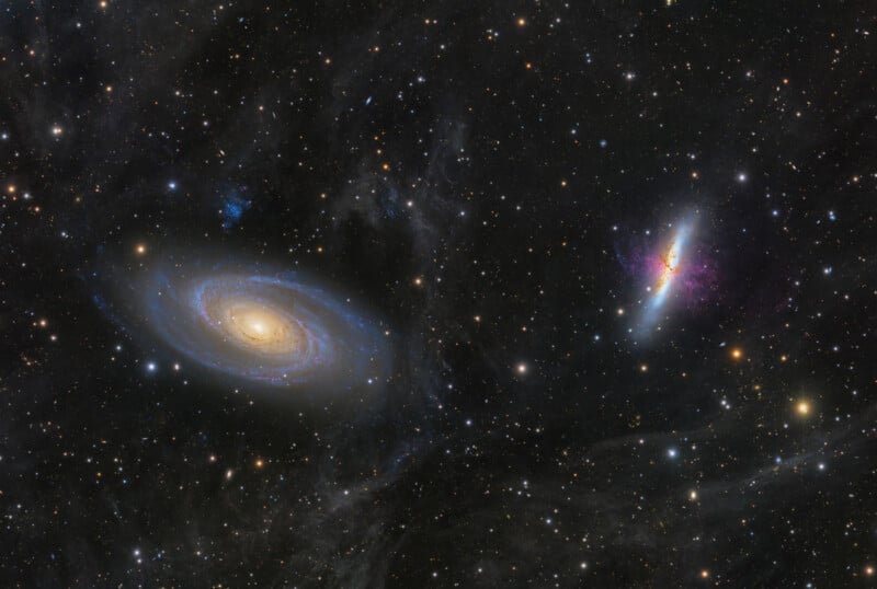  a spiral galaxy on the left with a glowing center and swirling arms, and an irregular, colorful galaxy on the right, both surrounded by stars and cosmic dust.