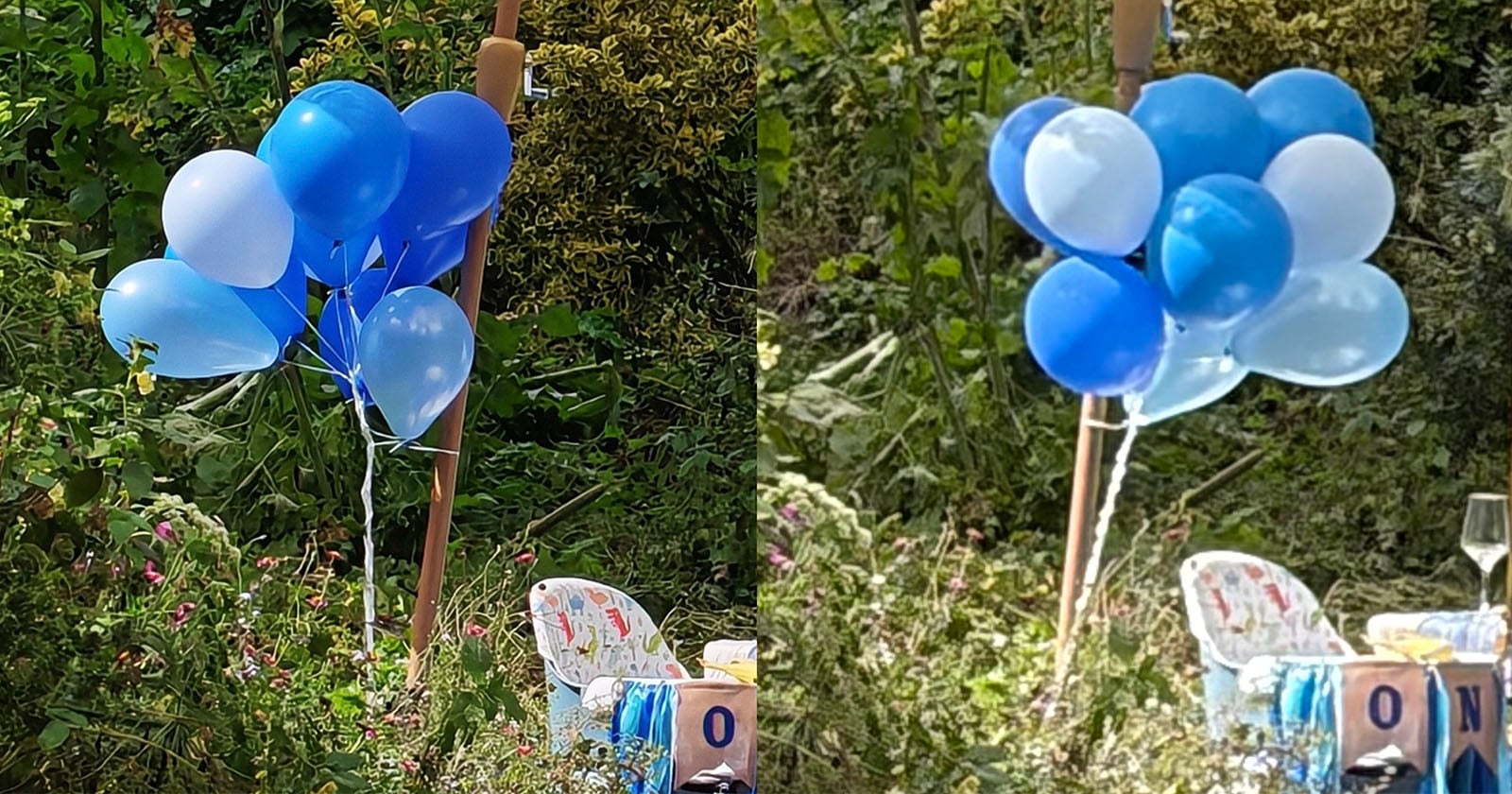 A bunch of blue and light blue balloons is tied to a stick outdoors amid greenery. Nearby are chairs, a baby-themed block, and a wine glass, suggesting a party or celebration in a garden setting.