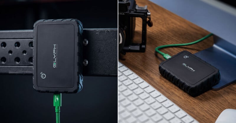  mounted on a metal bar and placed on a desk next to a keyboard, connected by a green USB cable.