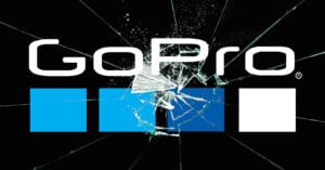 The GoPro logo with four blue and white rectangles beneath it, displayed over a background of shattered glass.