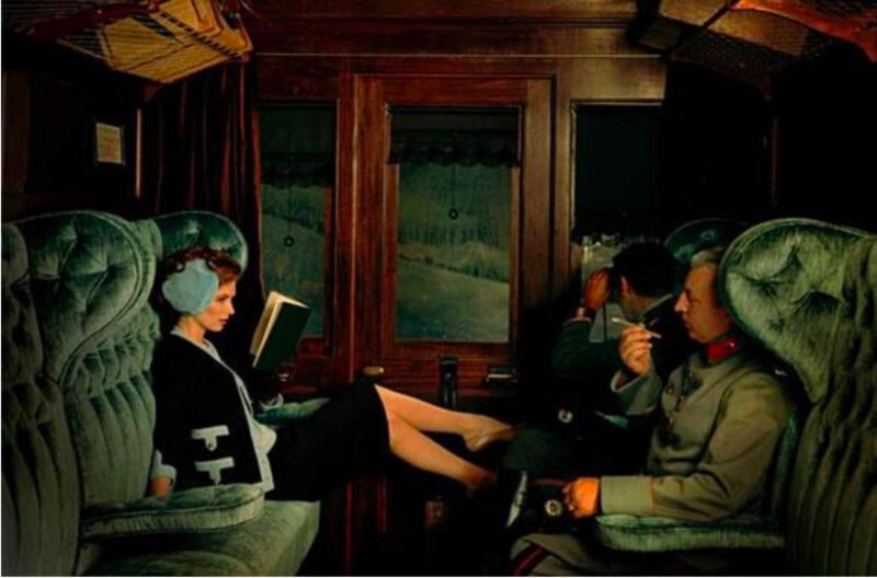 A woman with earmuffs reads a book and rests her feet on the seat opposite her in a vintage train compartment. Two men sit nearby, one smoking and the other looking out the window. The scene is lit warmly and feels retro.