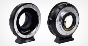 Two Metabones camera lens adapters are shown side by side, each featuring metallic lens mounts, electronic contacts, and a black cylindrical body with a stand at the base, displayed against a white background.