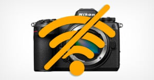 A Nikon camera with a large orange “no Wi-Fi” symbol overlay, indicating a lack of wireless connectivity or Wi-Fi connection issue.