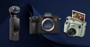 Three cameras on a dark blue background: a DJI Osmo Pocket handheld camera, a Sony Alpha mirrorless camera, and a Fujifilm Instax instant camera with a photo emerging from it.