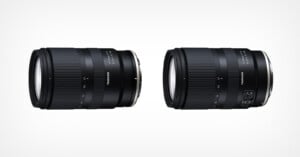 Two black Tamron camera lenses are displayed side by side on a white background, showing different angles and design features, including focusing rings and switches.