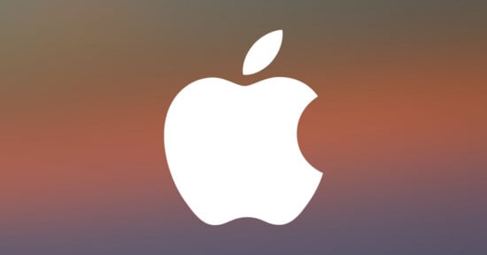 A white Apple logo with a bite taken out of the right side is centered on a blurred gradient background of warm and cool tones.