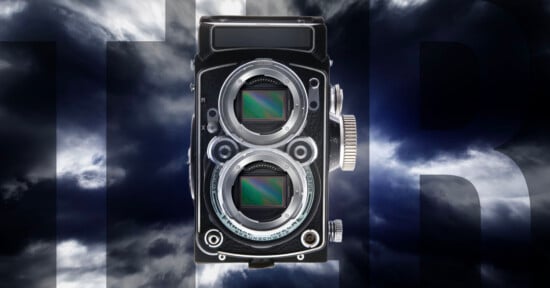 A vintage twin-lens camera with two visible digital sensors is set against a dramatic, cloudy sky background with large, partially visible letters "HR" in dark gray.