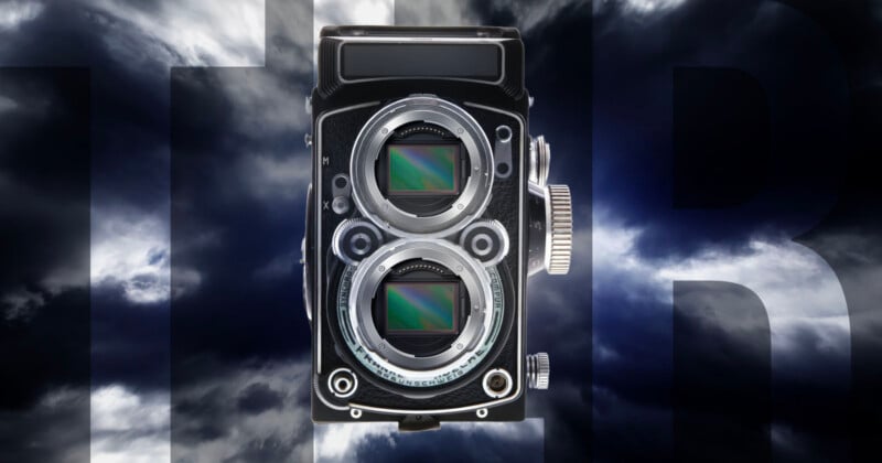 A vintage twin-lens camera with two visible digital sensors is set against a dramatic, cloudy sky background with large, partially visible letters "HR" in dark gray.
