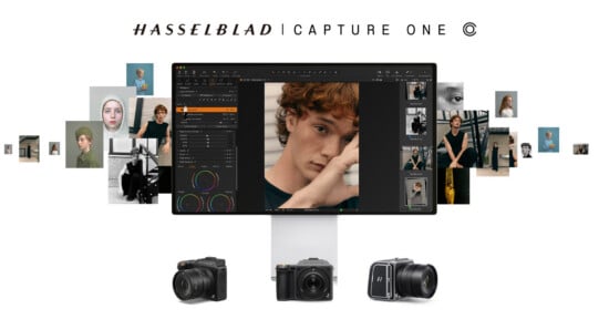 A computer monitor displays photo editing software with a portrait of a young man. Surrounding the monitor are various portrait photos, and below it are three Hasselblad cameras. The text reads "HASSELBLAD CAPTURE ONE.