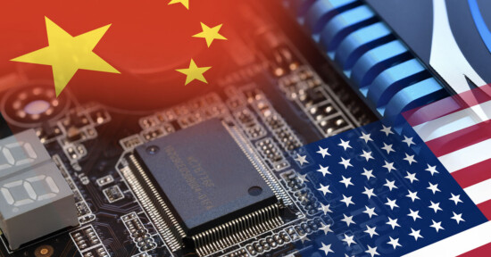 A computer chip and circuit board overlaid with the Chinese and U.S. flags, symbolizing technology competition or trade relations between China and the United States.