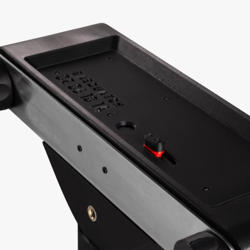 A close-up of a black and metallic camera tripod head with a sliding red and black adjustment knob and the word "SASQUATCH" embossed on the surface.