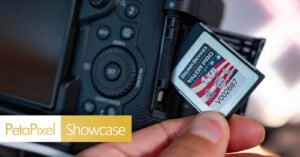 A hand inserts a 1TB memory card labeled "Delkin Devices" into a digital camera. The camera's LCD screen and control buttons are visible. "PetaPixel Showcase" text is displayed in the corner of the image.