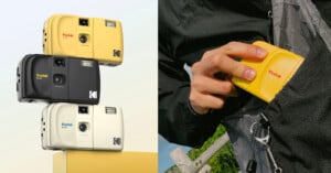 Three Kodak Ektar H35 cameras in yellow, black, and cream are stacked on the left, while a person on the right puts a yellow camera into a gray jacket pocket.