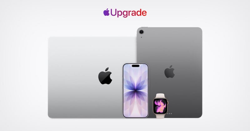Two MacBooks, an iPad, an iPhone with a flower wallpaper, and an Apple Watch are shown under the word "Upgrade" with an Apple logo, all on a white background.