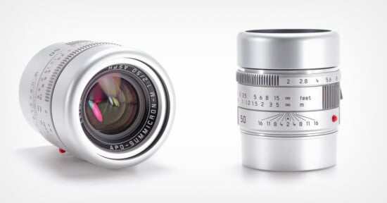 Two silver camera lenses are shown: one standing upright displaying its focus and aperture markings, the other lying on its side, showing its glass element and lens branding "APO-SUMMICRON-M 1:2/50.