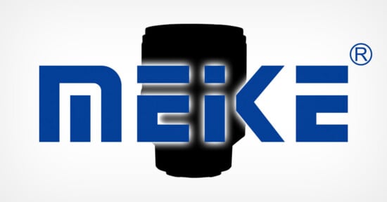 The image shows the word "MEIKE" in bold blue letters over a black camera lens silhouette, with a registered trademark symbol in the top right corner. The background is white and the letters have a slight glow.