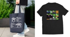 A person holds a navy tote bag with camera diagrams; next to it is a black t-shirt featuring colorful film roll labels arranged in a grid.