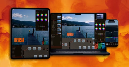 A tablet, laptop, and smartphone display the same photo editing software with color grading tools and an image of a person on a dock by a lake, set against an orange, smoky background.