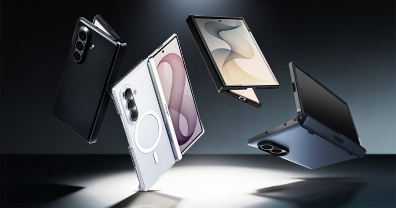 Five modern smartphones and foldable devices in black, white, and gray appear to be floating above a lit circular platform, displayed dramatically against a dark background.