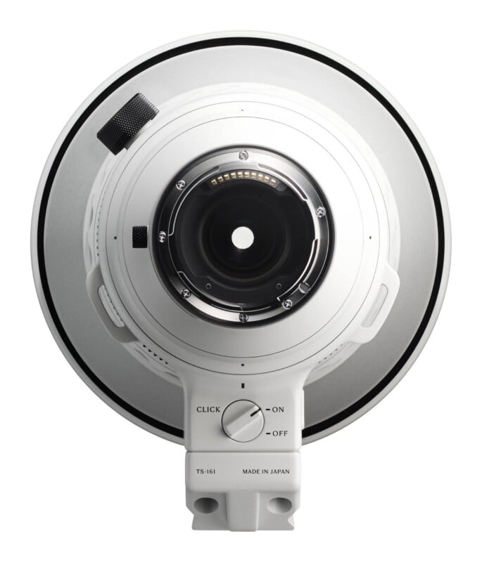 The rear view of a white camera lens featuring a metal mount, electronic contacts, and a dial labeled "CLICK" with "ON" and "OFF" settings.