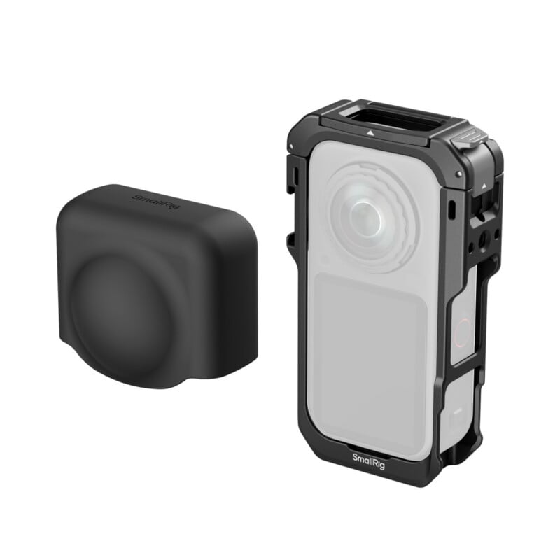 A black protective silicone lens cover sits to the left of a black camera cage housing a rectangular action camera.
