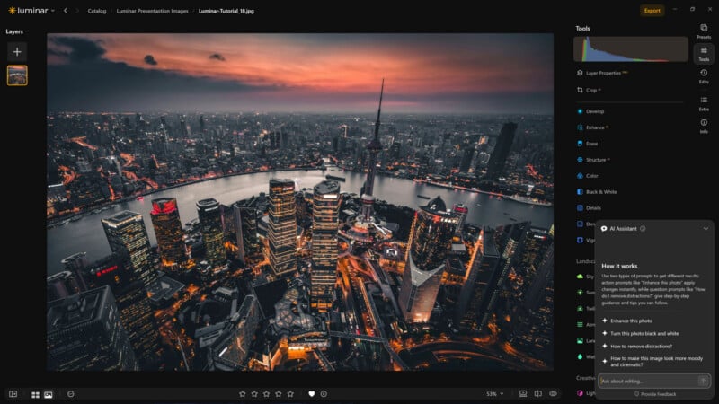 A software interface displays an aerial night view of a city skyline with a river, featuring an AI assistant panel on the right.