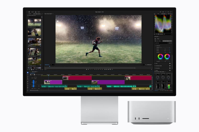 A computer monitor displaying video editing software with a rugby player on screen, positioned next to a silver desktop computer tower.