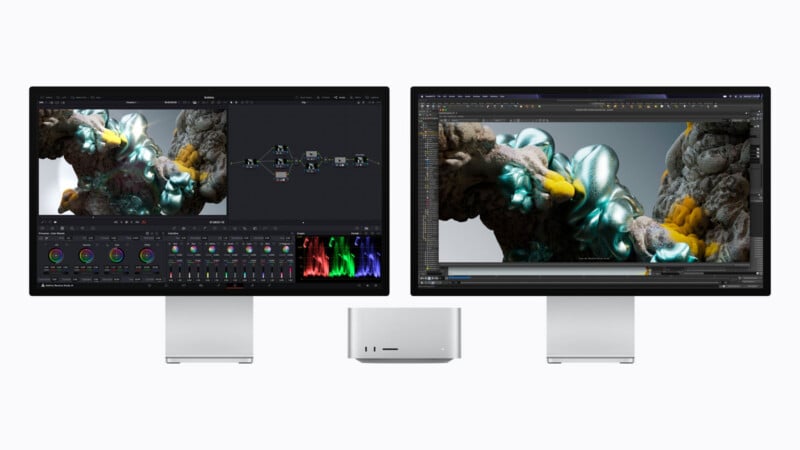 A Mac Studio computer sits centered between two Apple Studio Displays, each showing professional creative software interfaces with 3D rendered imagery.