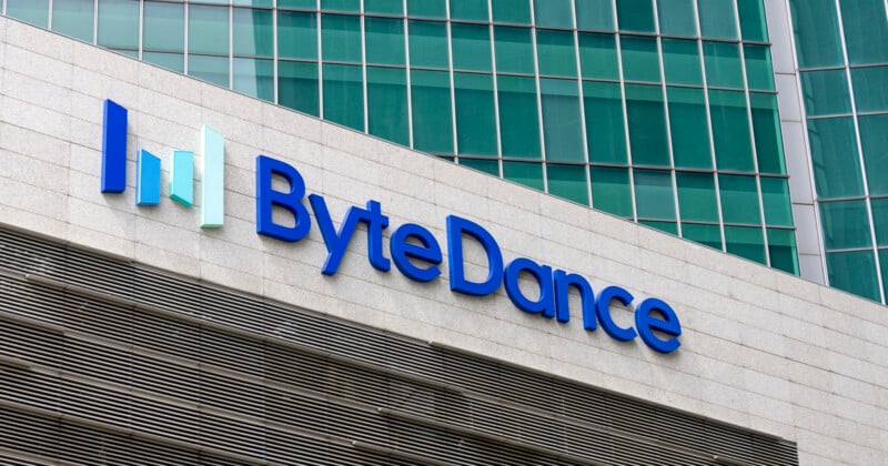 The ByteDance logo is mounted on a light-colored stone wall in front of a modern glass office building.