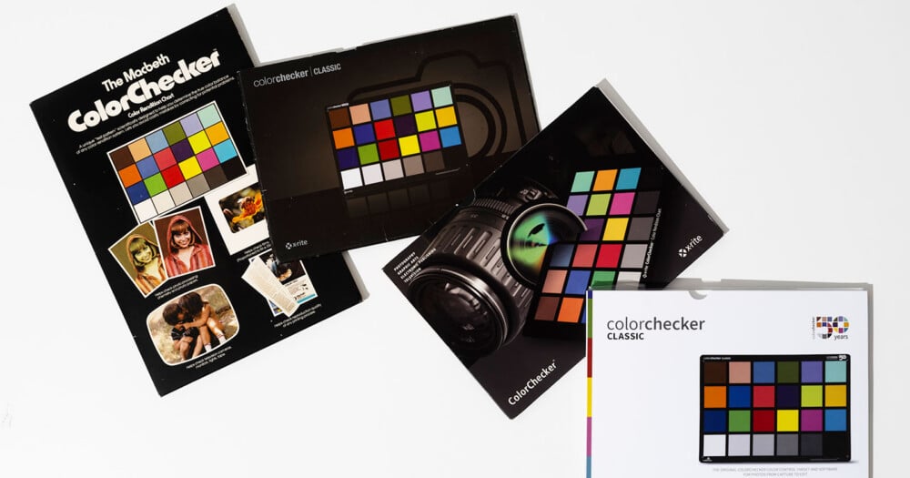 Four X-Rite ColorChecker Classic packaging boxes are arranged on a white surface.