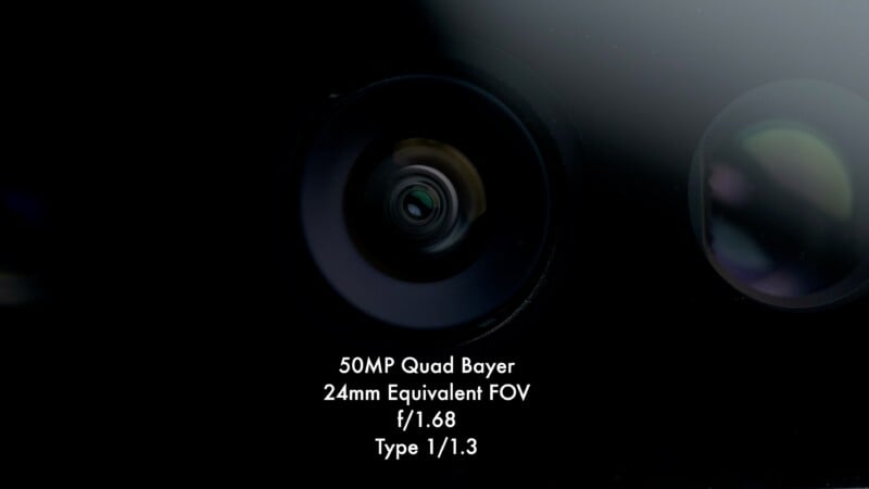 A close-up of a camera lens with text below it reading: 50MP Quad Bayer, 24mm Equivalent FOV, f/1.68, Type 1/1.3.