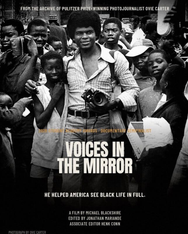 A black-and-white film poster for "Voices in the Mirror" features a smiling man with an afro holding a camera, surrounded by a crowd of children.