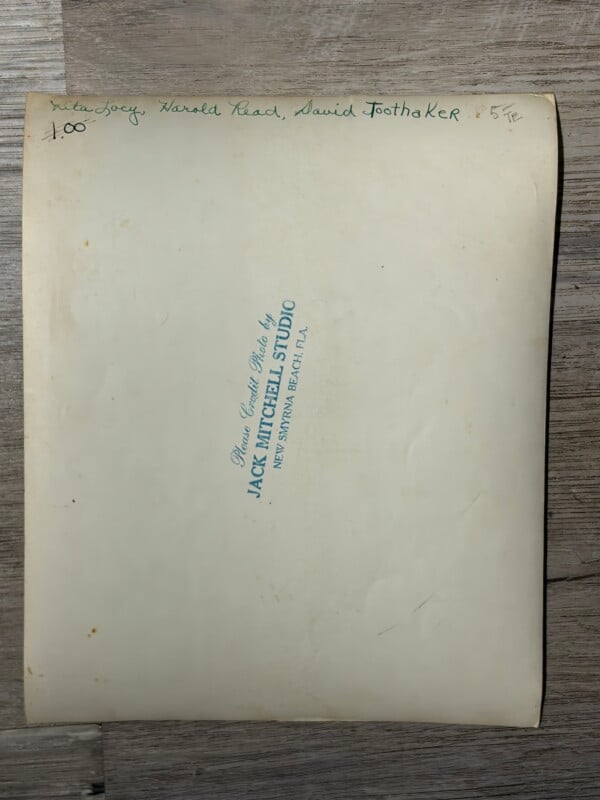 The back of a photograph with handwritten names "Rita Lacy, Harold Read, David Toothaker" and a stamp for Jack Mitchell Studio.