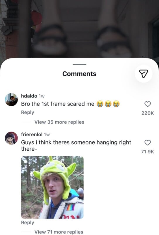 A social media comment section showing a user named frierenlol posting a meme of Logan Paul wearing a green alien hat in response to a video featuring a pair of feet dangling in the air.